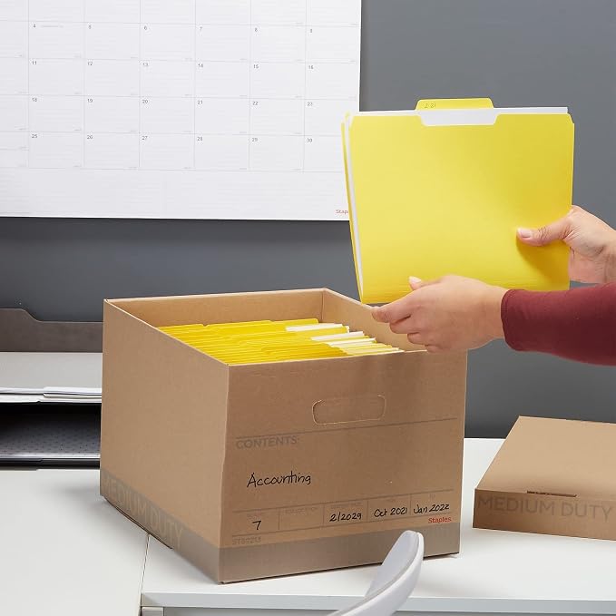 Staples Medium-Duty 100% Recycled Storage Boxes, Letter/Legal, 12-Pack | Eco-friendly stackable boxes for document storage in offices.