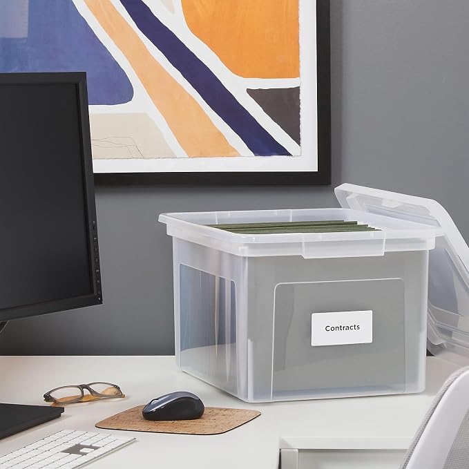 Staples Hanging File Folder Box, Storage Bin Organizer, Snap Lid, Clear | Fits letter and legal size documents. Stackable design keeps files secure and visible.