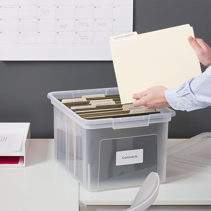 Staples Hanging File Folder Box, Storage Bin Organizer, Snap Lid, Clear | Fits letter and legal size documents. Stackable design keeps files secure and visible.